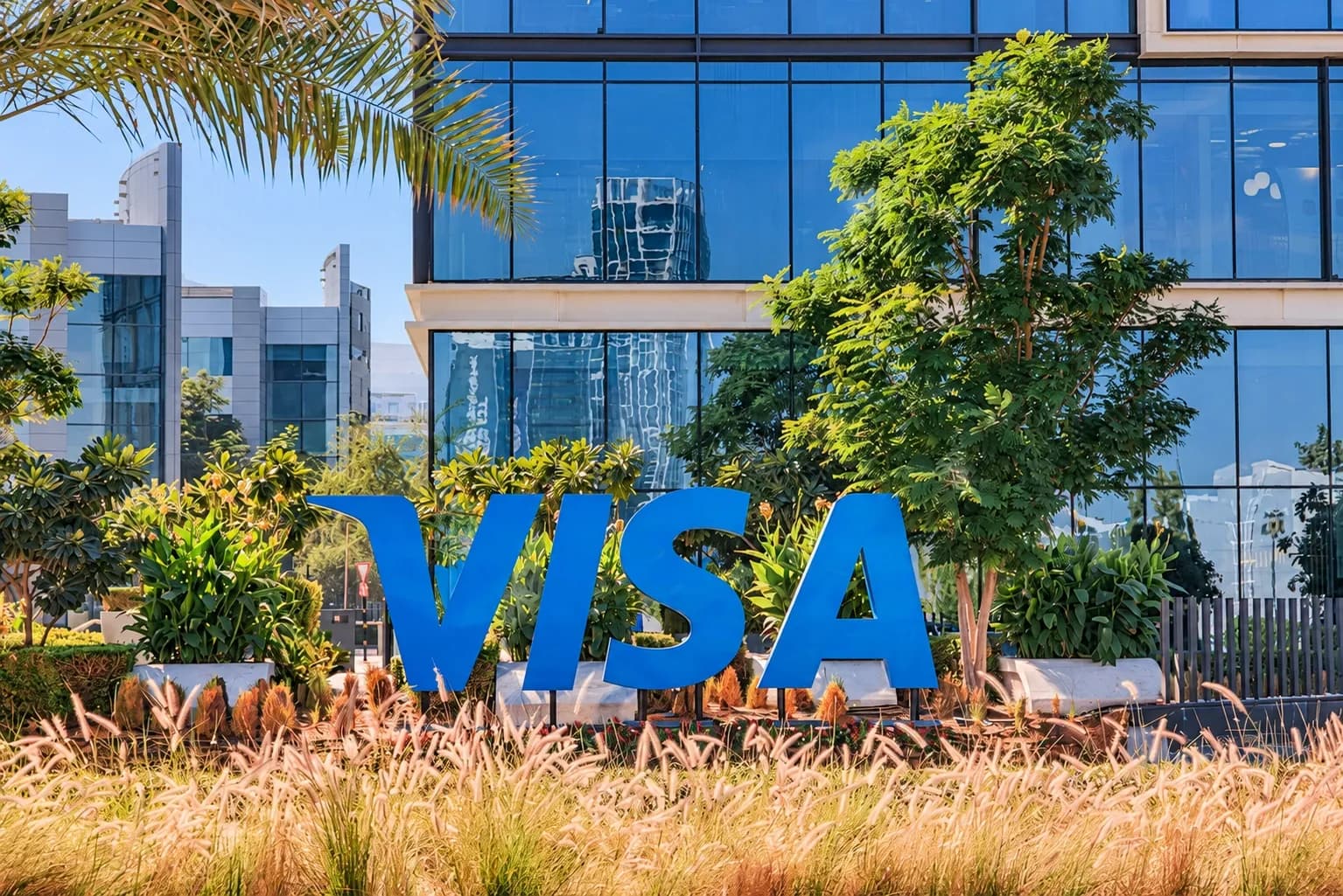 Visa and Tencent logos side by side on a white background